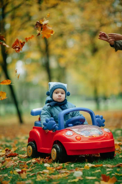 Little funny boy driving toy car — Stock Photo, Image