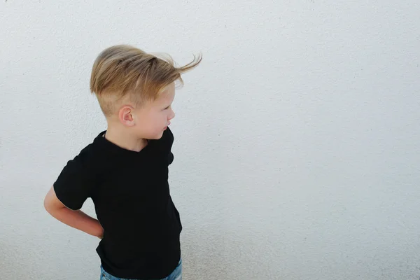 Young emotional boy on bright background — Stock Photo, Image