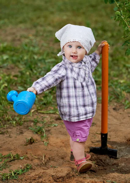 Funny boy with shovel in garden — Stock Photo, Image