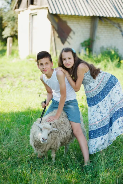 Brother and sister spend summer in village — Stock Photo, Image