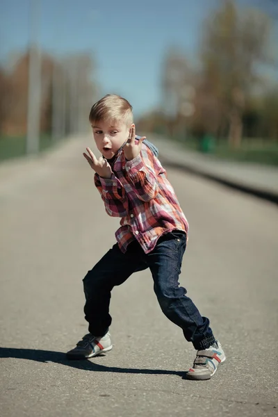 Grimacing boy outdoors portrait — Stock Photo, Image