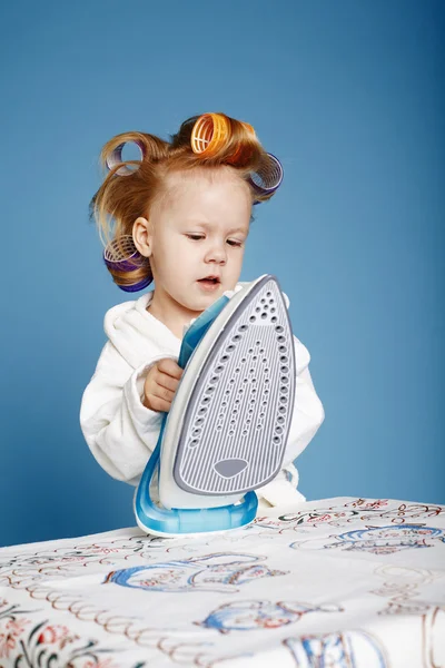 Little funny housewife with iron — Stock Photo, Image