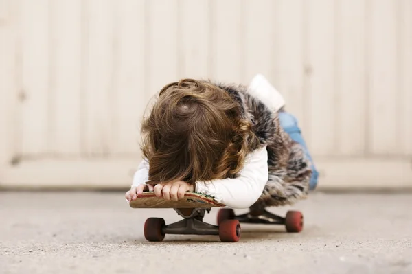 Cute little hipster girl with skateboard — Stock Photo, Image