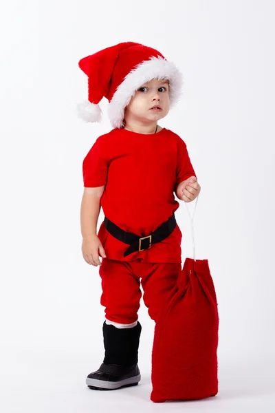 Noel Baba şapkası olan küçük şirin çocuk — Stok fotoğraf
