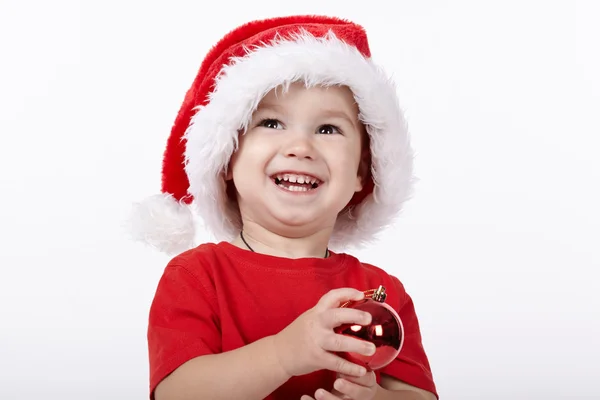 Kleiner süßer Junge mit Weihnachtsmütze — Stockfoto
