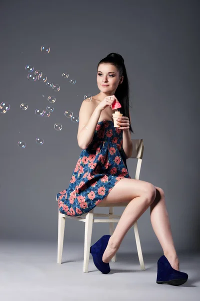 Beautiful brunette girl with bubbles — Stock Photo, Image