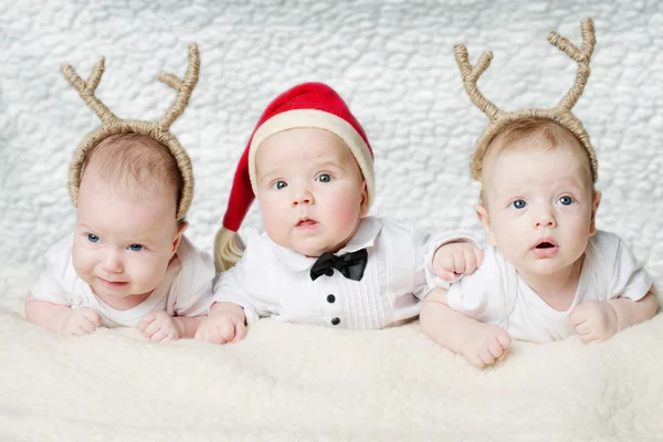 Cute babies with deer horns — Stock Photo, Image