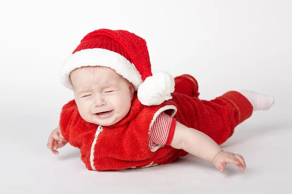 Kleiner weinender Weihnachtsmann auf weißem Grund — Stockfoto