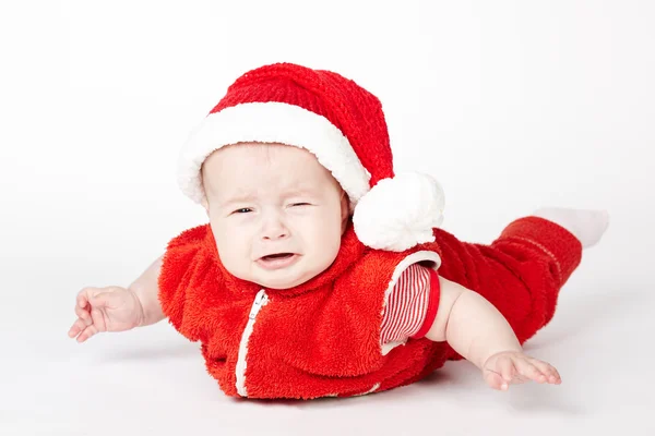 Kleiner weinender Weihnachtsmann auf weißem Grund — Stockfoto