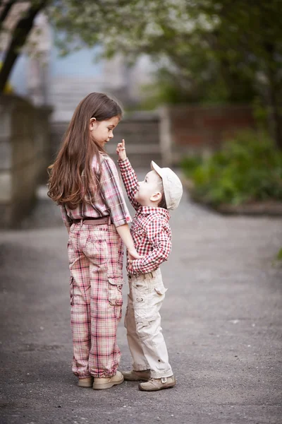 Boy hugging cute sister and looks up — Stock Photo, Image