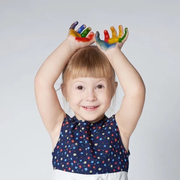 Little girl with hands in paint on white — Stock Photo, Image