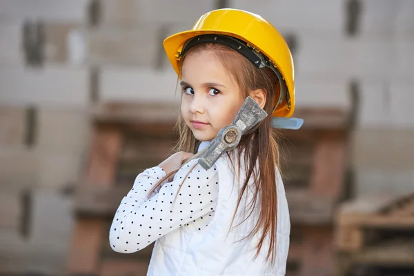 Little girl with helmet working on construction — Stock Photo, Image