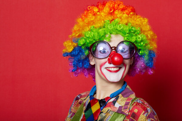 funny clown with glasses on red