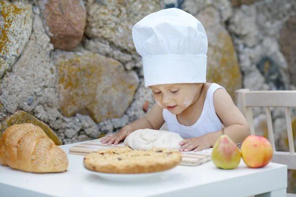 Little boy with chef hat cooking — Stock Photo, Image