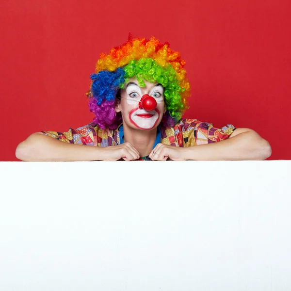 Funny clown with tie on blank board — Stock Photo, Image