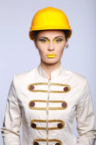 Beautiful girl with yellow helmet portrait — Stock Photo, Image