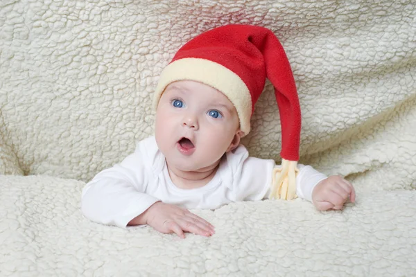 Cute baby in Santa hat — Stock Photo, Image