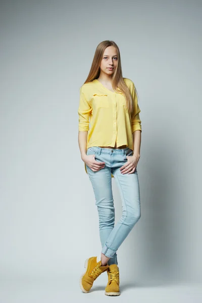 Girl with long hair posing in studio — Stock Photo, Image