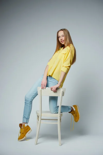 Girl with long hair posing in studio — Stock Photo, Image