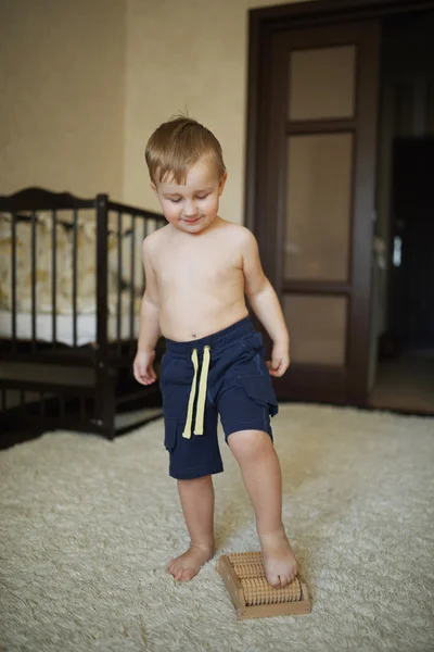 Little happy boy massage feet — Stock Photo, Image