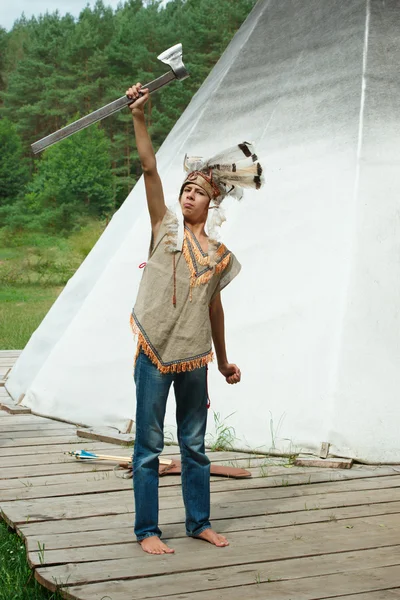 Funny boy with native american costume and weapon — Stock Photo, Image