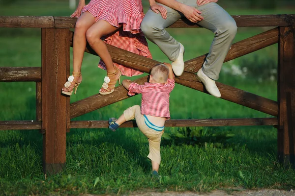 Little boy with parents outdoors — Stock Photo, Image