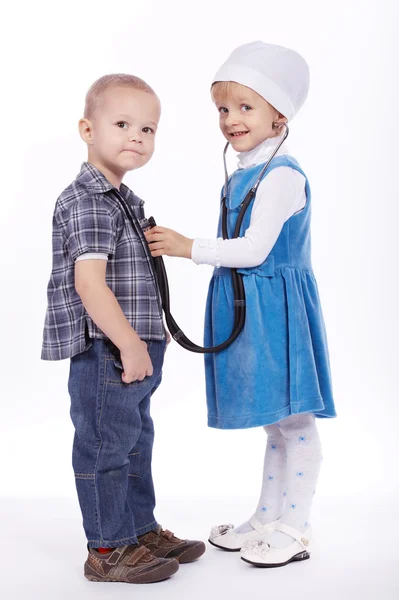 Little girl and boy playing with stethoscope — Stock Photo, Image