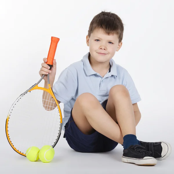 Menino com raquete e bolas — Fotografia de Stock
