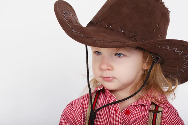 Petite cowgirl drôle sur fond blanc — Photo