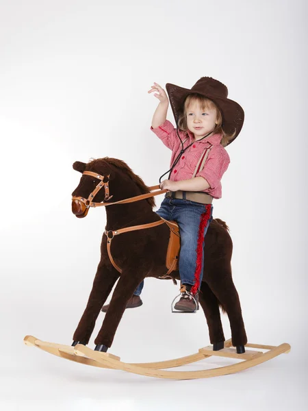Little funny cowgirl riding horse — Stock Photo, Image