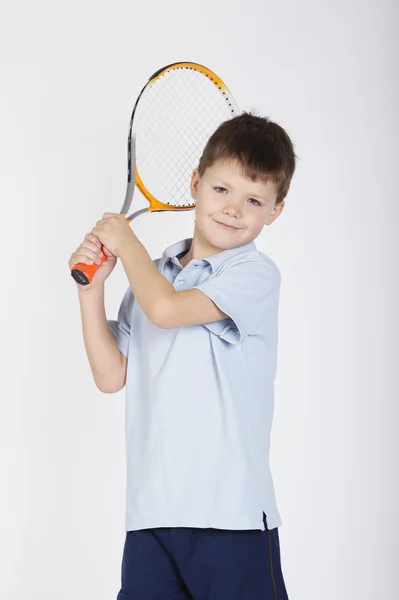 Menino com raquete e bolas — Fotografia de Stock