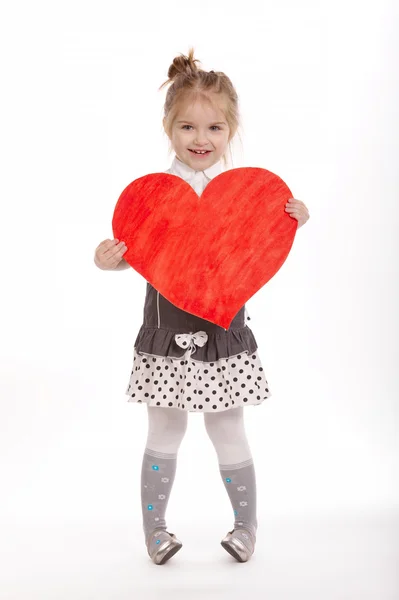 Beautiful young girl with heart — Stock Photo, Image