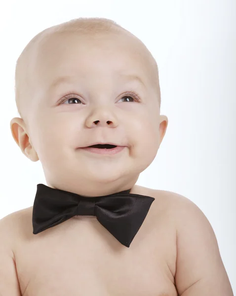 Pequeno menino bonito com laço — Fotografia de Stock