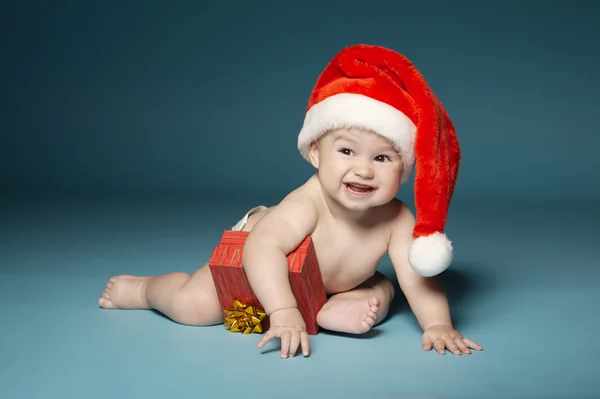 Niño en pañales con sombrero de Santa Claus — Foto de Stock