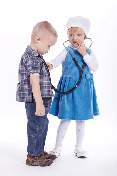 Little girl and boy playing with stethoscope — Stock Photo, Image