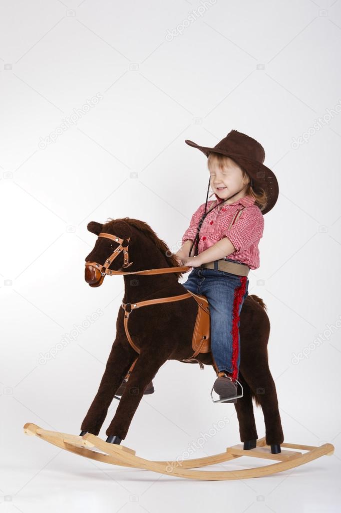 little funny cowgirl riding horse