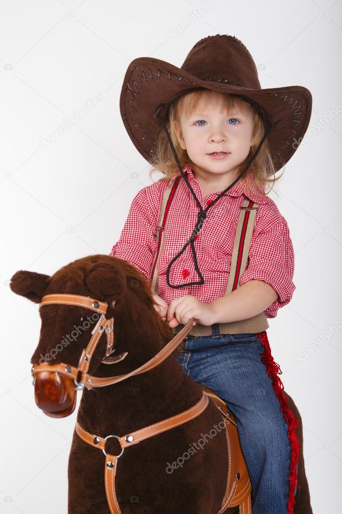 little funny cowgirl riding horse