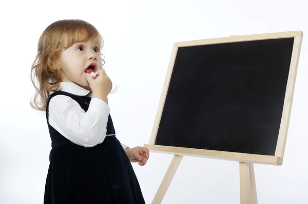 Little cute girl with blackboard on white background Stock Image