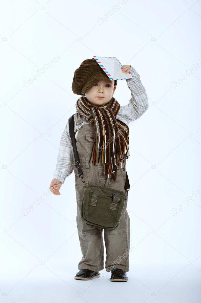 photo of little funny boy with letter