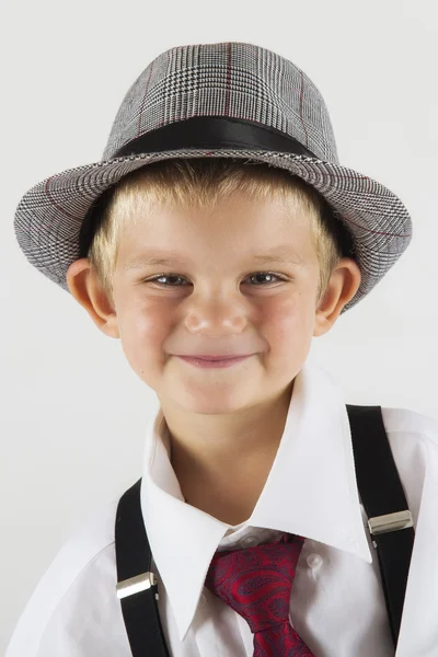 Portrait of a young boy with old hat being funny — Stock Photo, Image