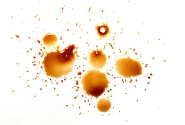 Beyaz arka planda lekeler olan kahve lekeleri.