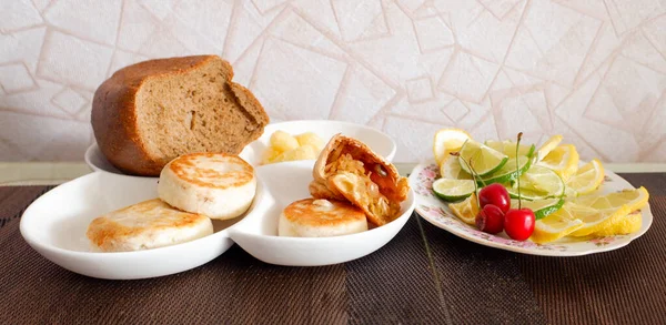 A plate with products on the table, lemon bread.