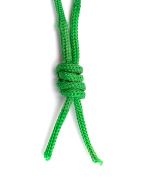 Beyaz arkaplanda yeşil ip yakın plan