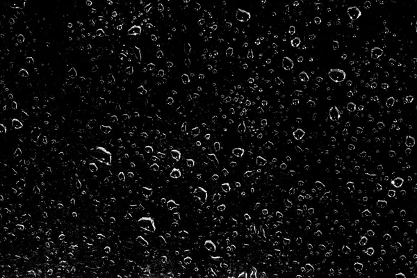 Gotas de agua sobre un fondo negro —  Fotos de Stock