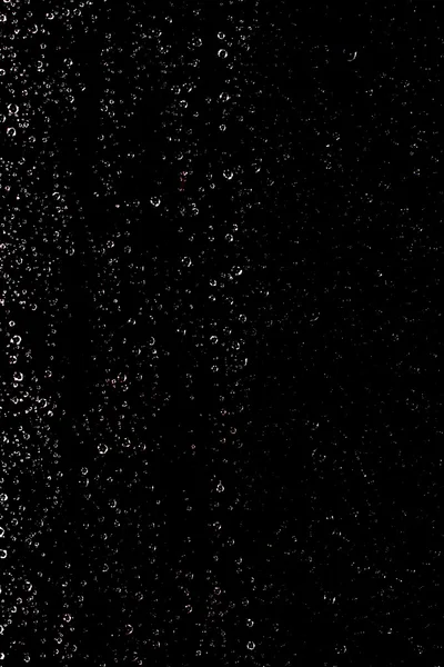 Краплі води на чорному тлі — стокове фото