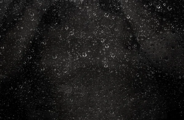 Gotas de água em um preto — Fotografia de Stock