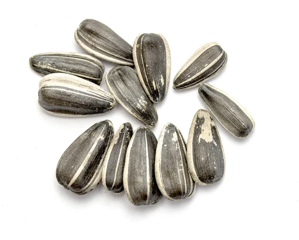 Sunflower seeds on white — Stock Photo, Image