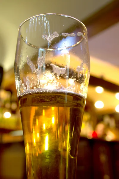 Beer glass in bar — Stock Photo, Image