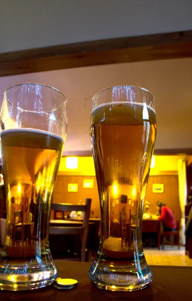 Beer glasses in bar — Stock Photo, Image