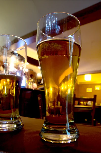 Beer glass in bar — Stock Photo, Image